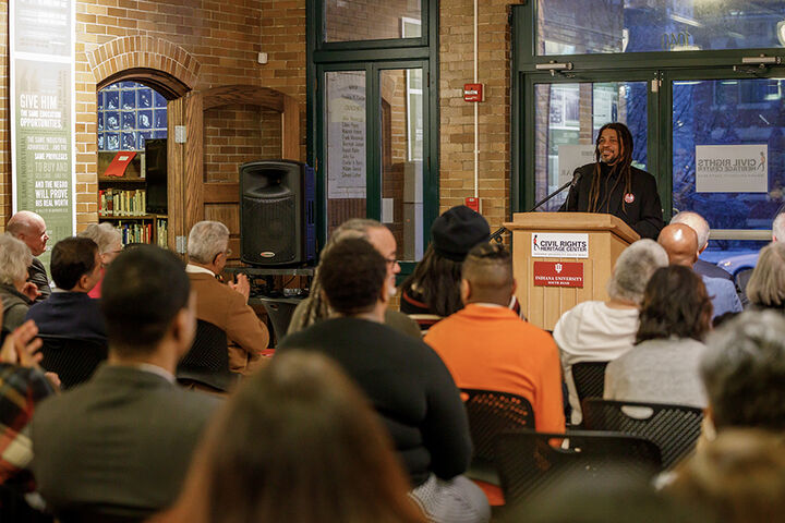A group of people listening to a lecture.